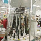 A 2004 Walmart gun display: After limiting its sales of firearms to a third of its outlets, the super chain is bringing back shotguns, hunting rifles, and bullets to 500 more stores.