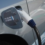 A hybrid car is plugged into a charging station in San Francisco, Calif.: Electric cars may have bigger carbon footprints than their gas-guzzling competitors, according to a new study.