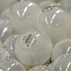 Standard light bulbs in a factory: A bill signed into law by George W. Bush that would phase out traditional bulbs starting in 2012 is being challenged by Republicans.