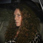 Former News International chief executive Rebekah Brooks leaves The News of The World office on July 7: Brooks was arrested Sunday as part of a widening phone-hacking and bribery scandal.