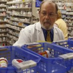 A Florida pharmacist fills prescriptions: Six of the 10 top-selling drugs will go generic in the next two years, which will make them cheaper for patients.