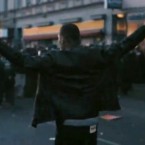 In Levi's new commercial, a denim-clad man faces a line of riot police, the sort of inadvertently topical imagery that led the company to pull the ad in Britain.