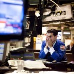 A trader looks concerned at the New York Stock Exchange: Europe's debt crisis is causing many to question whether stocks are no longer the promising investment they once were.