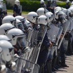 Riot police protect the Greek Parliament during austerity protests: With other EU countries not far behind, Greece's meltdown is sending the global economy into a tailspin.