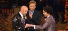 Under an autumnal chuppah, Conan O'Brien married the show's costume designer Scott Cronick (left) and his partner David Gorshein (right) on national television Thursday night.