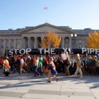 Protesters form a 12,000-person human chain around the White House on Sunday, and call for President Obama to say no to the proposed 1,700-mile Keystone XL oil pipeline from Canada to the Gulf Coast.
