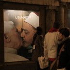 "Unhate" ads outside a Benetton store in Rome: The controversial ad of the Pope kissing an Egyptian Iman has been yanked after the Vatican complained.