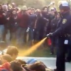 A California cop pepper sprays peaceful protesters at the University of California, Davis, on Friday: The two police officers involved have been placed on leave.