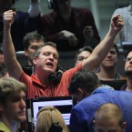 Traders at the Chicago Board Options Exchange on Wednesday: Stocks surged after the Federal Reserve and other central banks announced a joint effort to ease Europe's debt crisis.