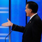 Mitt Romney extends his hand and bets Texas Gov. Rick Perry $10,000 during Saturday's debate, a potential reminder to struggling Americans that Romney is very, very wealthy.