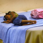Cassandra Martin, age 6, lies on a bed in a Texas shelter in 2009: Thanks to the recession, 1 in 45 American children is now homeless.