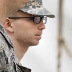 Bradley Manning (right) is escorted to the courthouse Sunday for the third day of his hearing: The alleged WikiLeaker was incarcerated for 18 months before getting his day in court.