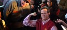 Rick Santorum poses for a picture while stumping in Iowa: The former senator's poll numbers are skyrocketing, but critics believe he'll fall back to Earth like so many other flavors of the month.