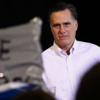 Mitt Romney has a brush with an Occupy protester while campaigning in New Hampshire: The former Massachusetts governor's business experience is being called into question, even by fellow Republicans.