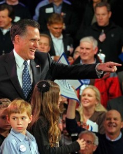 Former Massachusetts Gov. Mitt Romney celebrates in Manchester, N.H., after his big win in the Granite State Tuesday evening.