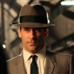 Despite curse-filled episodes of cable shows like "Mad Men," broadcast TV must operate as if "it's 1963," according to one commentator.