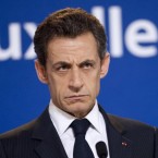 French President Nicolas Sarkozy says S&P's credit downgrade of his country "changes nothing," though critics say it foreshadows disaster for the eurozone.