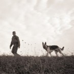 A man and his dog in the 1930s: The discovery of two 33,000-year-old dog skulls suggests that domesticated dogs were actually our ancient ancestors' best friends, too.