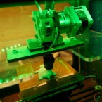 3D printers create objects layer by layer from digital files; this 3D printer is making a plastic turtle.