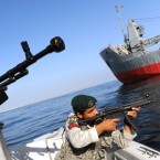 Soldiers take part in Iranian naval maneuvers near Iran's Strait of Hormuz: Tehran has threatened to block the busy oil-shipping route, through which 17 million barrels of oil travel every day.