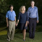 Page and her husband, Allan (left), care for Page's ex-husband, Robert (right), whose brain was severely damaged in an accident.