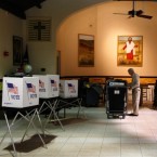A volunteer sets up a polling station in preparation for Tuesday's GOP primary in Florida: The Sunshine State winner will gain big-time momentum heading into Super Tuesday on March 6.