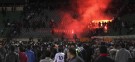Soccer fans flee from a fire at Port Said Stadium in Cairo Thursday: 74 people were killed in a breach of security that critics say may allow the military to prolong its hold on Egypt.