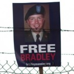 A "Free Bradley Manning" sign hangs from barbed wire in Fort Meade, Maryland: The accused WikiLeaks informant has been nominated for the Nobel Peace Prize.