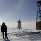 A 2006 image of a man at the Vostock research camp in Antarctica: Researchers have finally drilled through two miles of polar ice to reach the ancient sub-glacier lake.