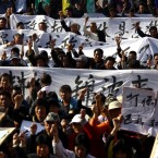 Residents rally in southern China: The country's economic boom has made the gap between the haves and the have-nots all the more obvious.