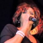 Whitney Houston sings an impromptu song at a pre-Grammy party Thursday in what turned out to be her final performance.