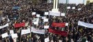 Demonstrators protest near Homs: Syrian forces resumed their bombardment of the city of Homs Monday after Arab countries called for U.N. peacekeepers.