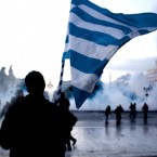 Protesters in front of the Greek Parliament in Athens during clashes with riot police: A Greek default could be as painful for the global economy as Lehman Brothers' 2008 collapse.