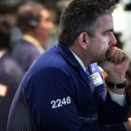 Traders on the New York Stock Exchange: The Dow Jones Industrial Average reached 13,000 points on Tuesday for the first time since the 2008 financial crisis.