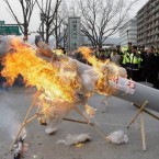 South Korean protesters burn a mockup of a North Korean missile during a demonstration against the North's failed April 13 rocket launch.