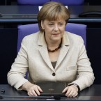 German Chancellor Angela Merkel is urging Greece to comply with the terms of its austerity program, or risk losing its place in the European Union.