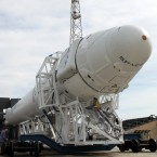 The Dragon spacecraft and its Falcon 9 rocket are rolled to the Cape Canaveral, Fla., launchpad for tests ahead of the landmark liftoff scheduled for May 19.