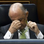 Spain's Finance Minister Cristobol Montoro reacts during a session of parliament Wednesday: The struggling country reached a new low this week when interest costs on Spanish bonds hit seven percent.
