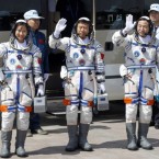 Chinese astronauts, including the country's first female space traveler (left), before liftoff on June 16.