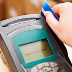 If approved by a federal judge, a Visa-Mastercard settlement would give merchants the power to charge customers who pay with credit cards an extra fee.