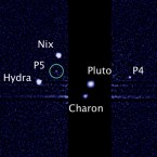An image taken by NASA's Hubble Space Telescope shows five moons orbiting the distant, icy dwarf planet Pluto: The green circle marks the newly discovered moon, designated P5.