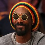 Snoop Dogg sports a Rastafarian look while watching a Lakers game on May 18: Now, the rapper is officially going reggae with a new sound, new look, and new name.