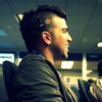 NASA's Bobak Ferdowsi: Note the yellow stars dyed into the shaved sides of his black mohawk, which itself is highlighted with wisps of red and blue.