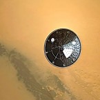 The Curiosity rover's heat shield can be seen falling to Mars' surface as the space lab makes its historic landing onto the Red Planet.&nbsp;