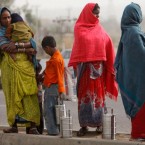 Migrant workers along with their children wait to be employed for the day in Jammu, India: Two-thirds of India's 1.2 billion people live on less than $2 a day.