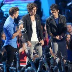 Three of the young, strenuously coiffed members&nbsp;of One Direction: The boy band swept the MTV Video Music Awards.