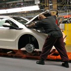 Assembly line workers build a Chevy Volt at the General Motors Detroit Hamtramck Assembly Plant in Hamtramck, Michigan.