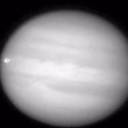 In this screen shot from an amateur astronomer's video, Jupiter appears to be hit by something, resulting in a two-second explosion.