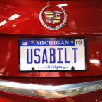 The license plate on the first 2013 Cadillac ATS available for retail is shown after the vehicle rolls off the assembly line at a General Motors plant on July 26.