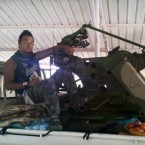 Chris Jeon mans an anti-aircraft weapon in Ras Lanuf, Libya.